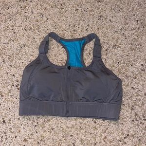 Zip sports bra. NEVER WORN!